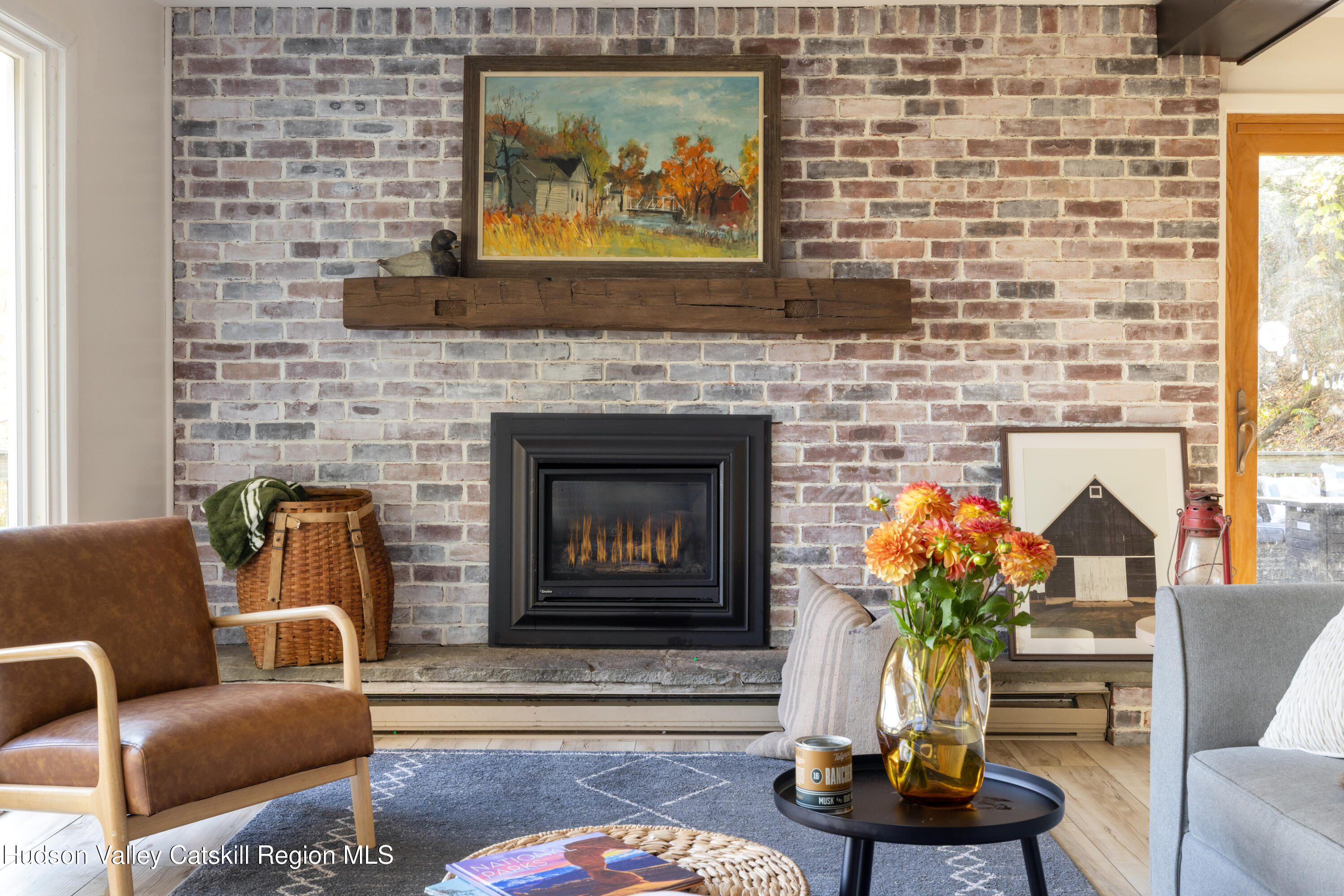 6 Clearview Road Hunter, NY 12442 - Photo 14 of 31 a living room with furniture potted plant and a fireplace