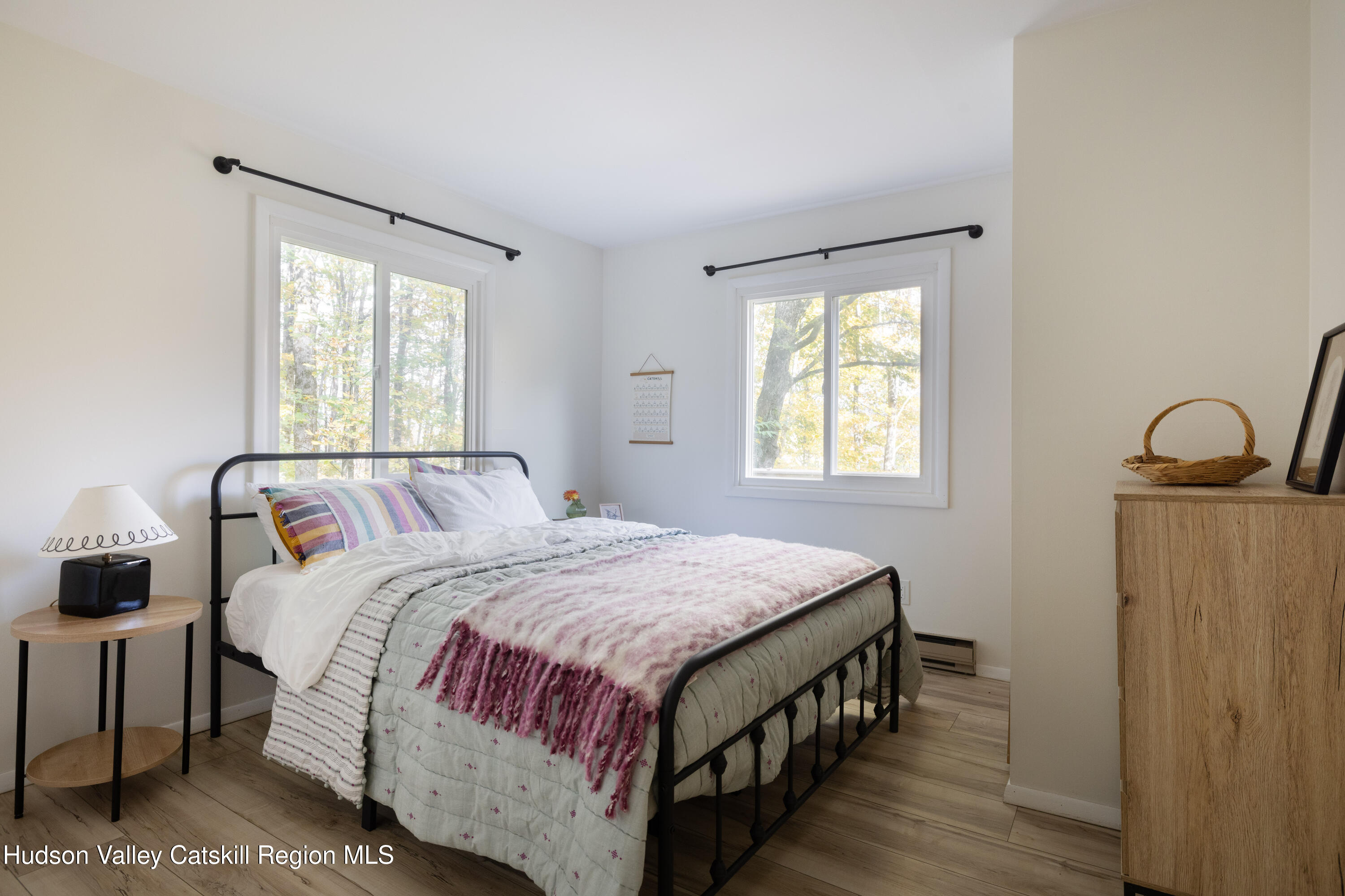 6 Clearview Road Hunter, NY 12442 - Photo 22 of 31 a bedroom with a bed a dresser and window