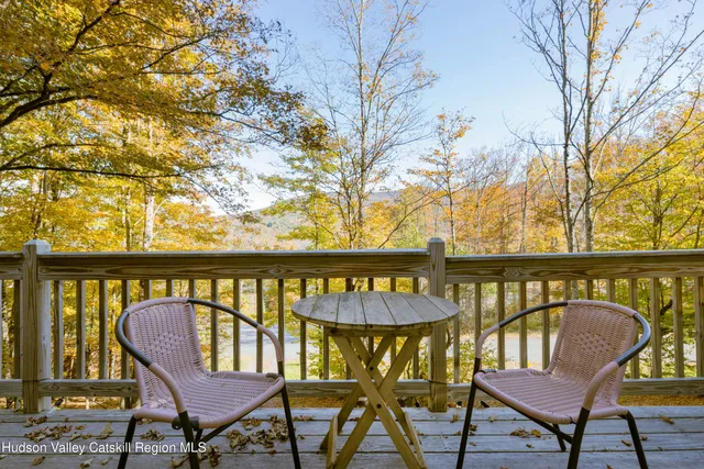 a view of a chair and table in the balcony