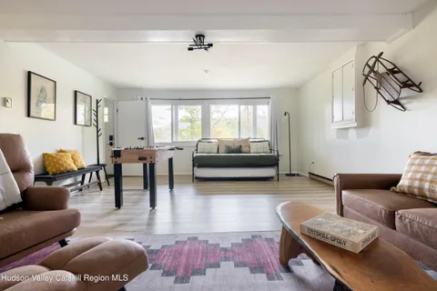 a bedroom with a bed and a potted plant