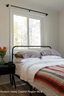 a living room with lots of furniture and a wooden floor