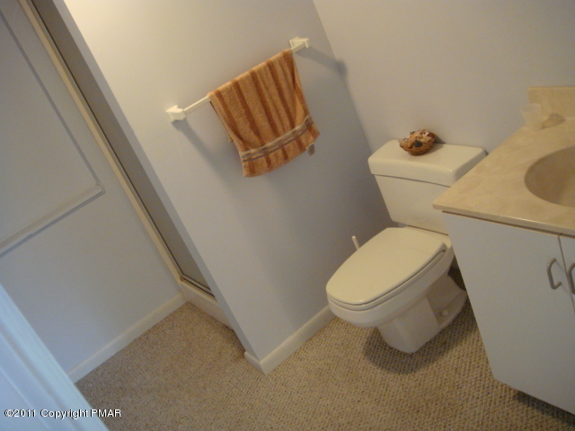726 Decker Road Bushkill, PA 18324 - Photo 13 of 28 a white toilet sitting next to a white cabinet