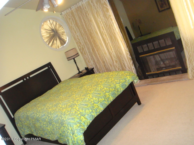 726 Decker Road Bushkill, PA 18324 - Photo 14 of 28 a bed sitting in a bedroom next to a window