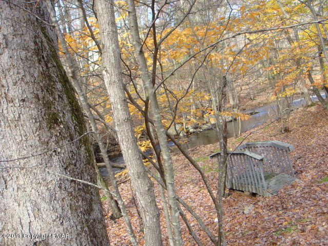 726 Decker Road Bushkill, PA 18324 - Photo 23 of 28 a backyard of a house with lots of green space