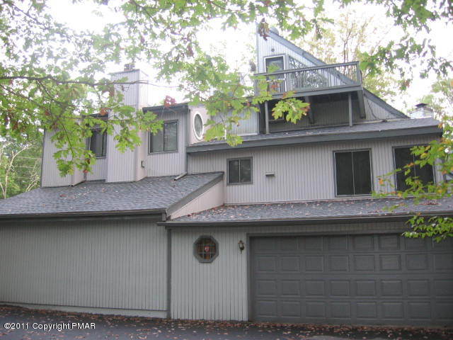 726 Decker Road Bushkill, PA 18324 - Photo 26 of 28 a side view of a house with a garden
