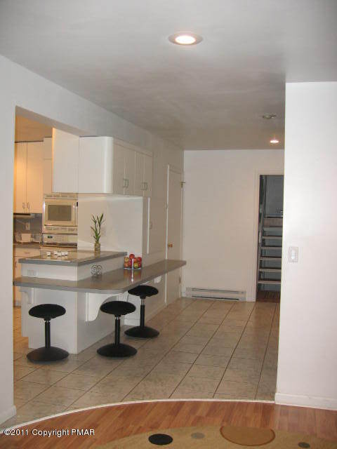 726 Decker Road Bushkill, PA 18324 - Photo 4 of 28 a room with a table and chair