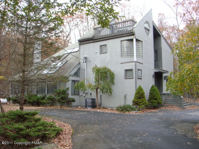 726 Decker Road Bushkill, PA 18324 - Photo 10 of 28 a view of a white house next to a road and yard