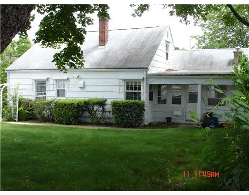 243 Knight Street Woonsocket, RI 02895 - Photo 3 of 11 Exterior Back. Three season room on right overlooks private yard.