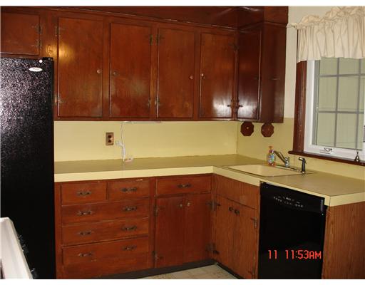 243 Knight Street Woonsocket, RI 02895 - Photo 5 of 11 Kitchen. Eat in kitchen sets off from the three season room.