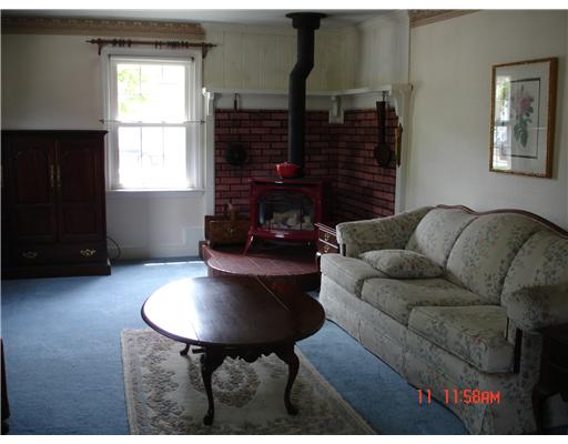 243 Knight Street Woonsocket, RI 02895 - Photo 7 of 11 Living Room. Beautiful living area is warmed be gas stove.