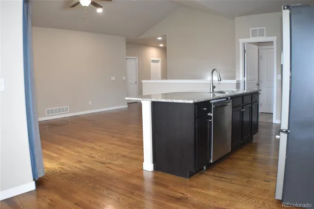 an empty room with wooden floor
