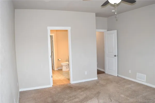 an empty room with a bathroom