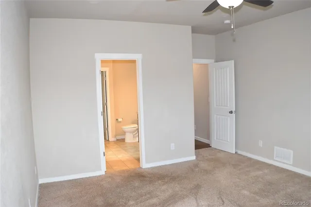 an empty room with a bathroom