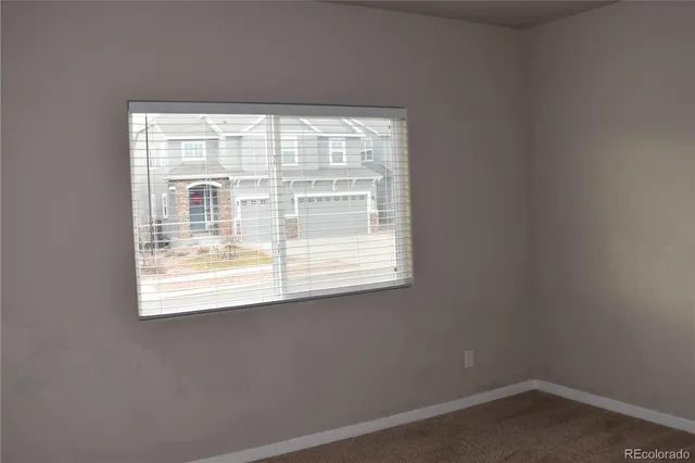 a view of hallway with wooden floor
