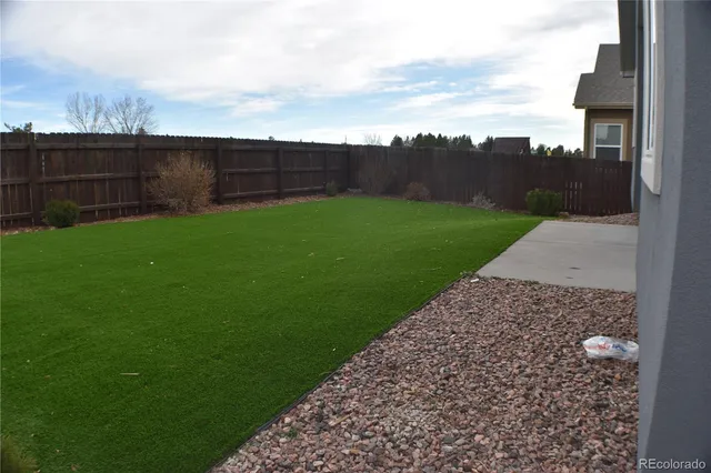 a house that has a big yard in front of it