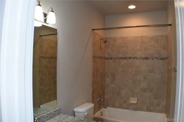 a bathroom with a shower and a toilet