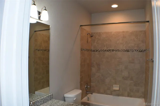 a bathroom with a shower and a toilet