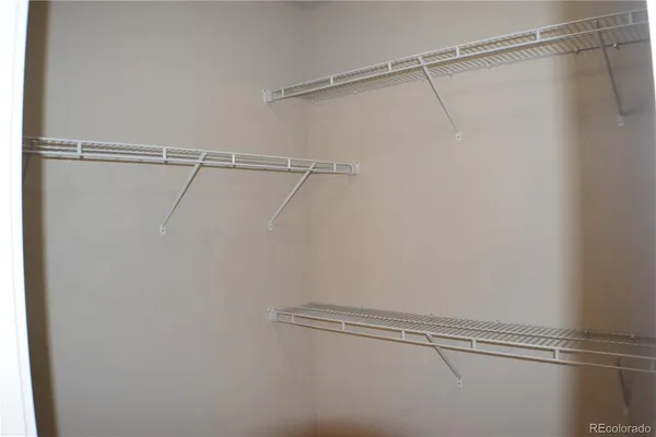 a view of a room with racks on the wall