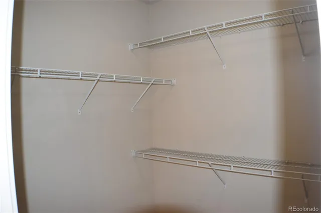a view of a room with racks on the wall