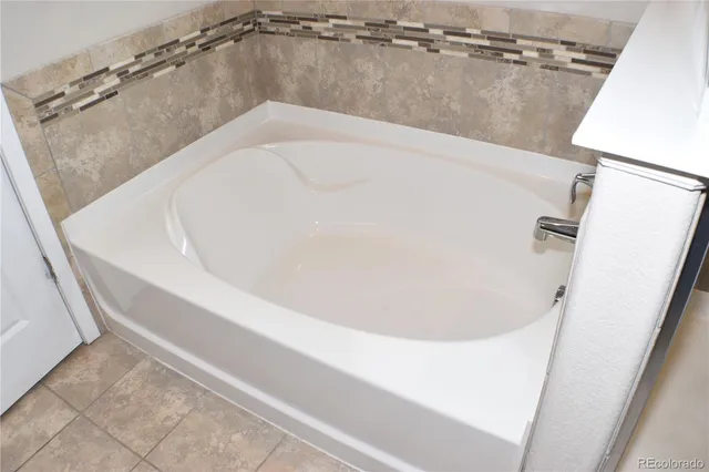 a view of a bathtub in bathroom