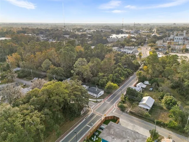 an aerial view of residential houses with outdoor space