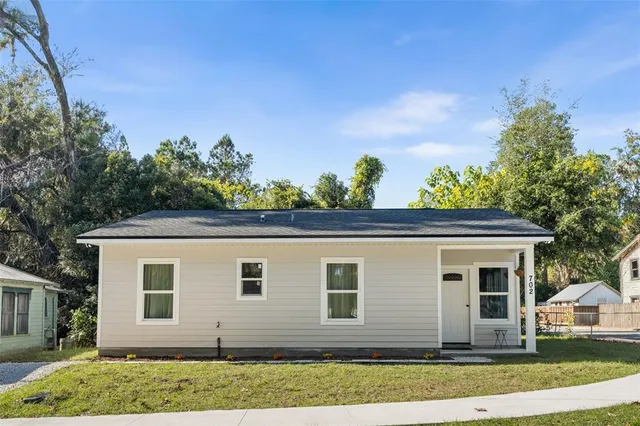 front view of a house with a yard