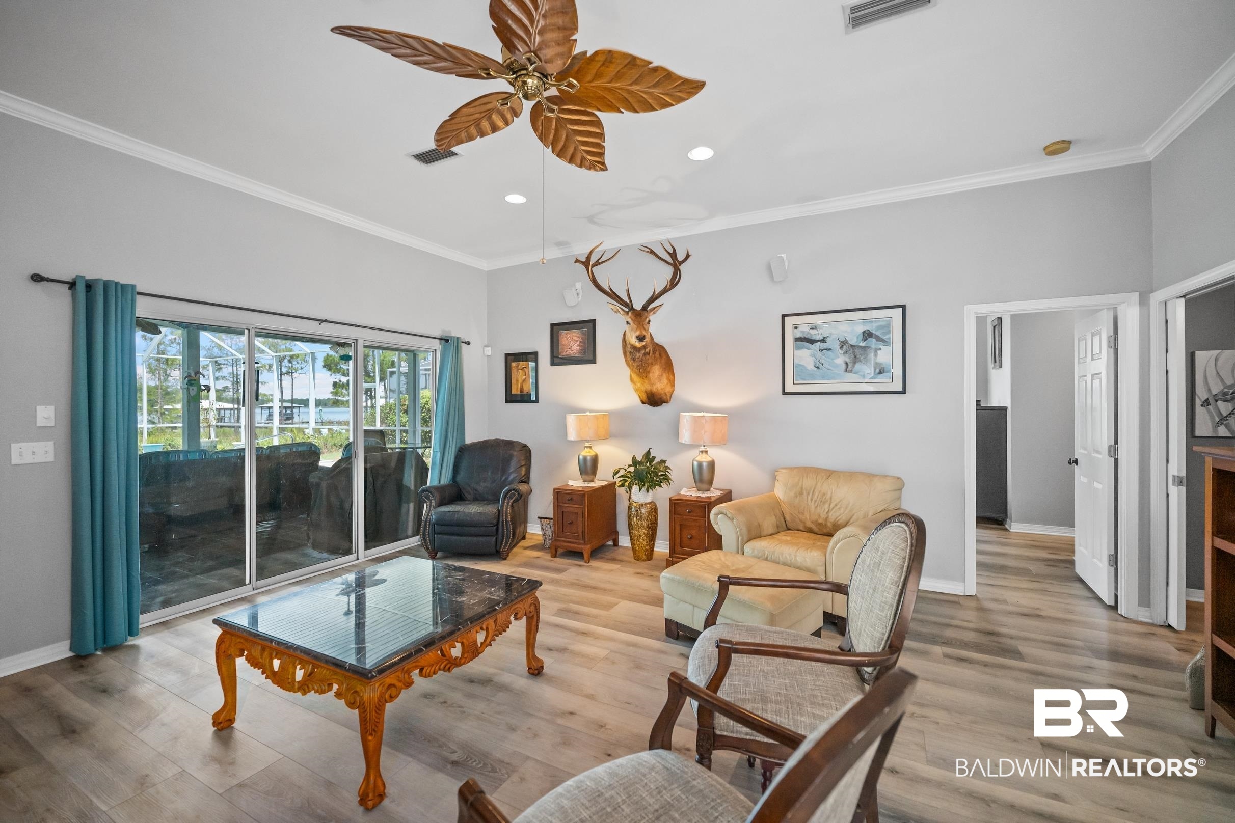 8585 Bay Harbor Road Elberta, AL 36530 - Photo 17 of 51 Living area with recessed lighting, a ceiling fan, ornamental molding, and light wood-type flooring