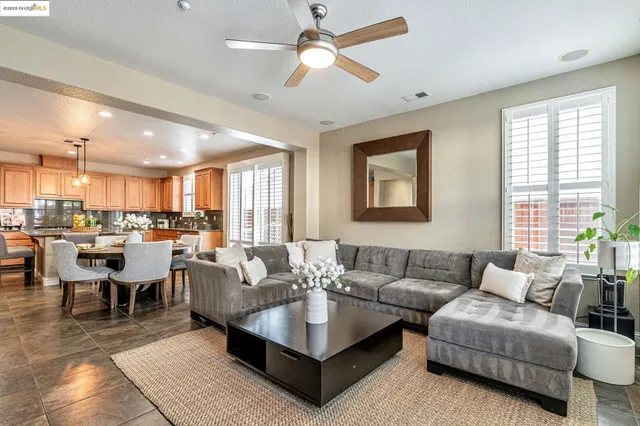 a spacious bedroom with a bed and a couch