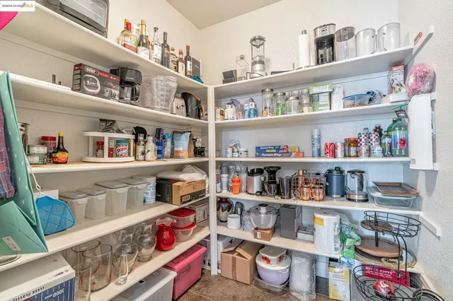 a view of a dining room with furniture wooden floor and chandelier