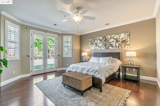 a spacious bedroom with a bed and a couch