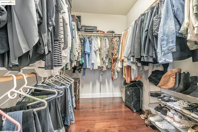 a bedroom with a bed and a potted plant