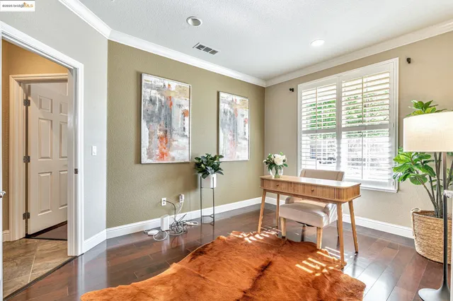 a bedroom with bed and a window