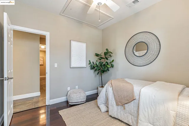 a bathroom with a sink mirror and toilet