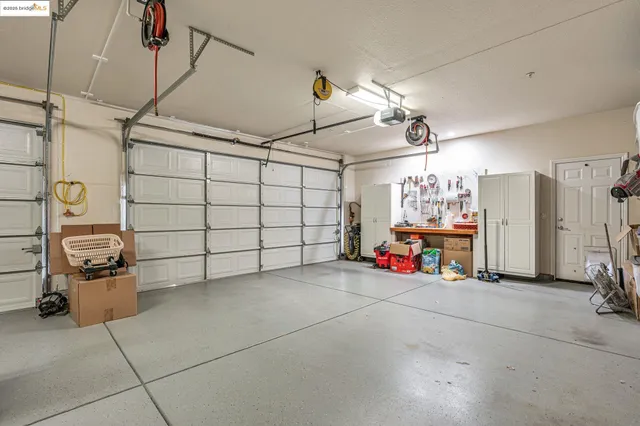 an aerial view of residential houses with outdoor space and ocean view