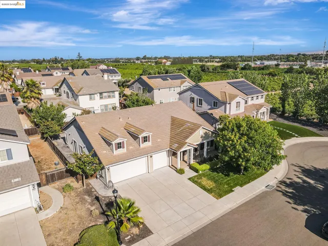 an aerial view of residential building and trees