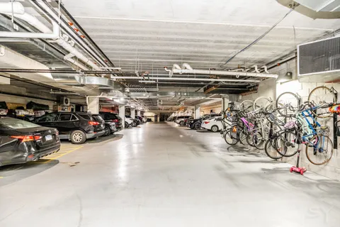 a view of parking garage with cars