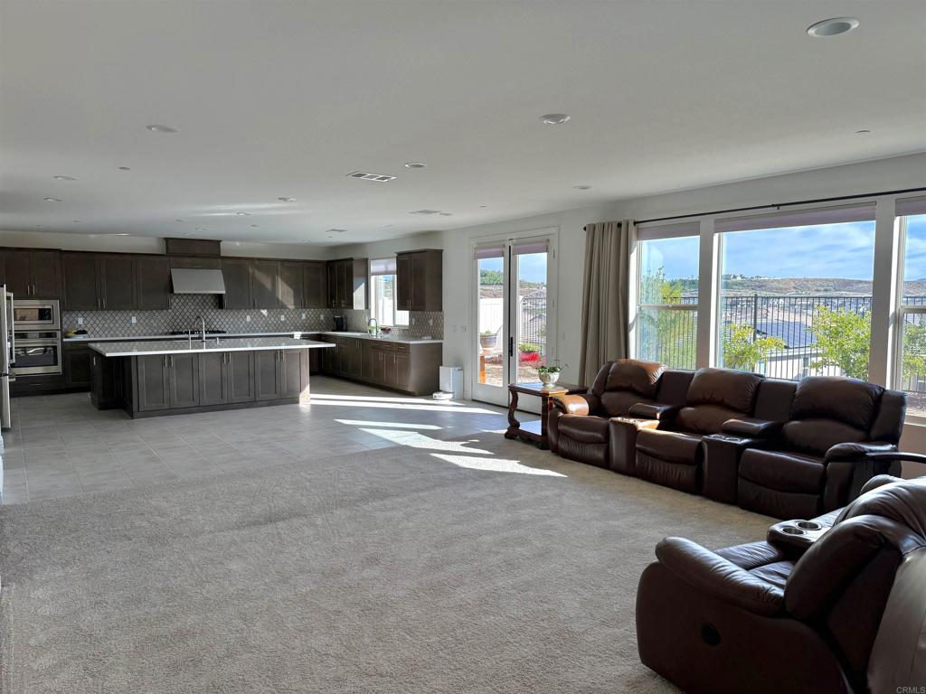 39529 Dayspring Way Temecula, CA 92591 - Photo 5 of 49 a living room with furniture and a kitchen