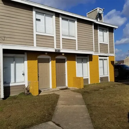a front view of a house with glass windows