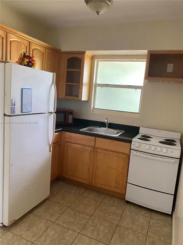 a utility room with closet a washer and dryer