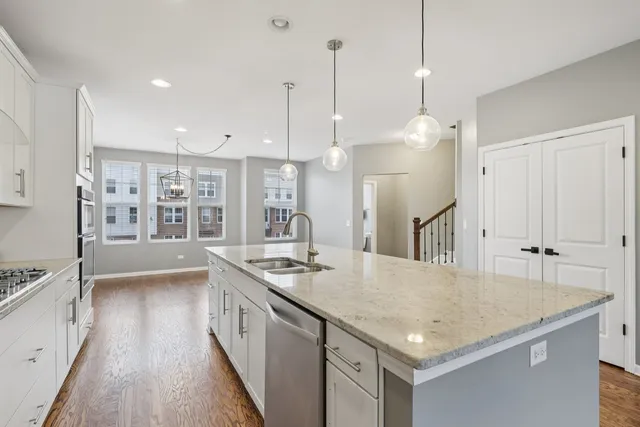a kitchen that has a lot of cabinets in it
