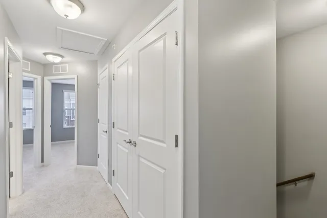 a view of a hallway with closet area