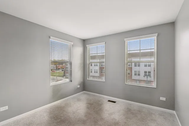 a view of an empty room with windows