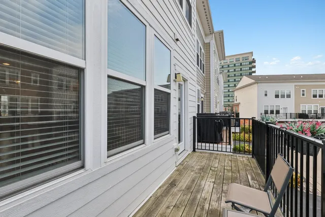 a view of a balcony with furniture