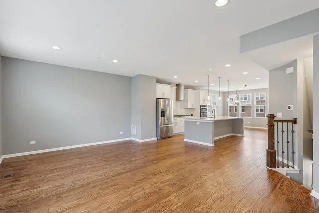 a view of kitchen dining table chairs and kitchen view