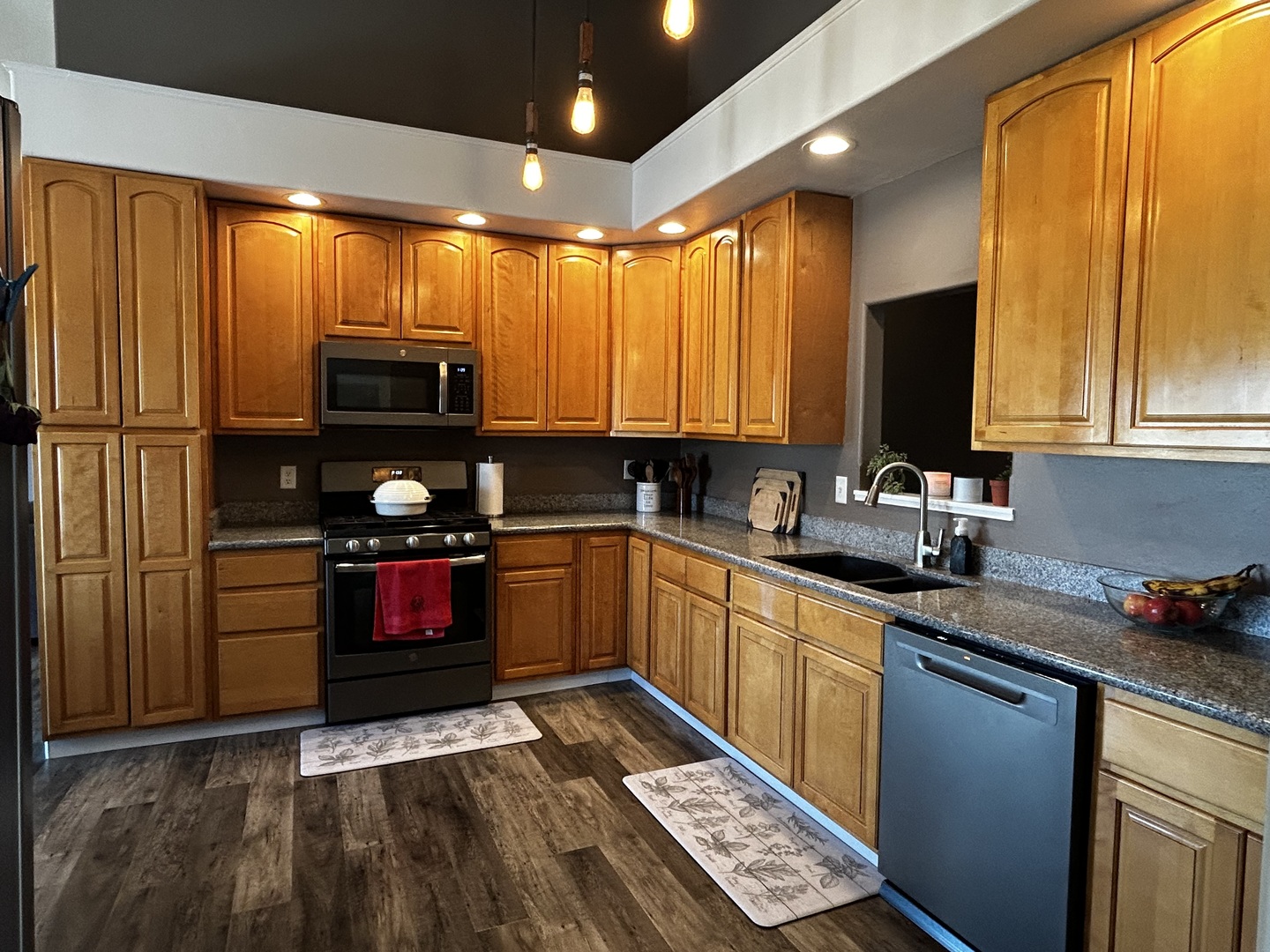 12795 Lawrence Road Sterling, IL 61081 - Photo 17 of 42 a kitchen with stainless steel appliances a stove sink and microwave