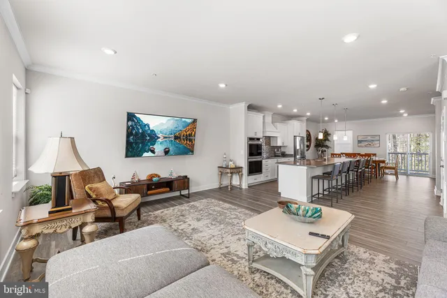 a kitchen with stainless steel appliances a refrigerator sink and cabinets
