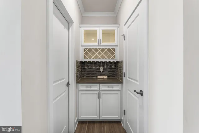 a bedroom with a bed couch and a window