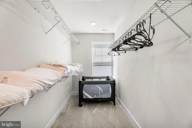 a bathroom with a granite countertop bathtub shower sink vanity and toilet
