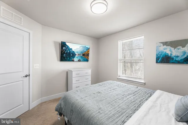 an aerial view of a house with swimming pool and ocean view