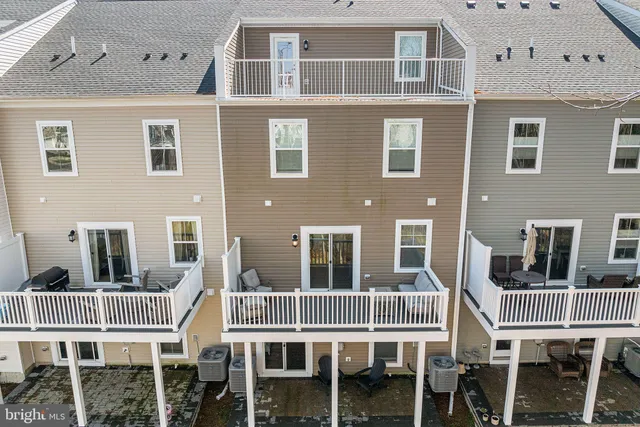 a view of entryway with furniture and wooden floor